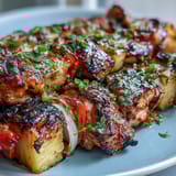 Tropical Grilled Pineapple Chicken Skewers featuring tender chicken, colorful veggies, and a honey-lime glaze.  