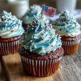 Red, white, and blue swirled frosting adorns these Star-Spangled Banner Cupcakes.