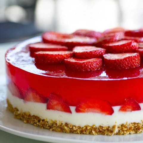 This layered Strawberry Pretzel Salad shows a perfect slice, inviting flavors and textures.